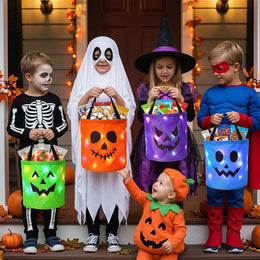 All four LED trick-or-treat buckets shown together, each with a different jack-o-lantern face